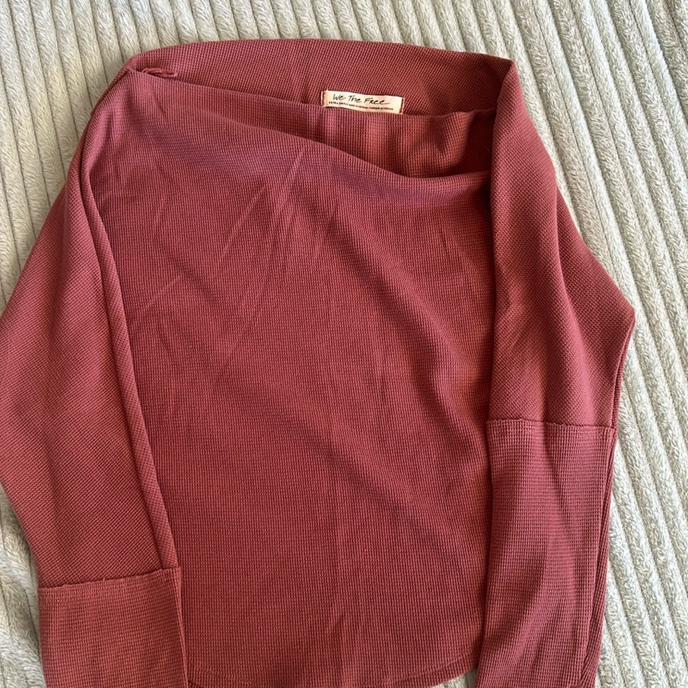 Free People rose colored ribbed one shoulder top.